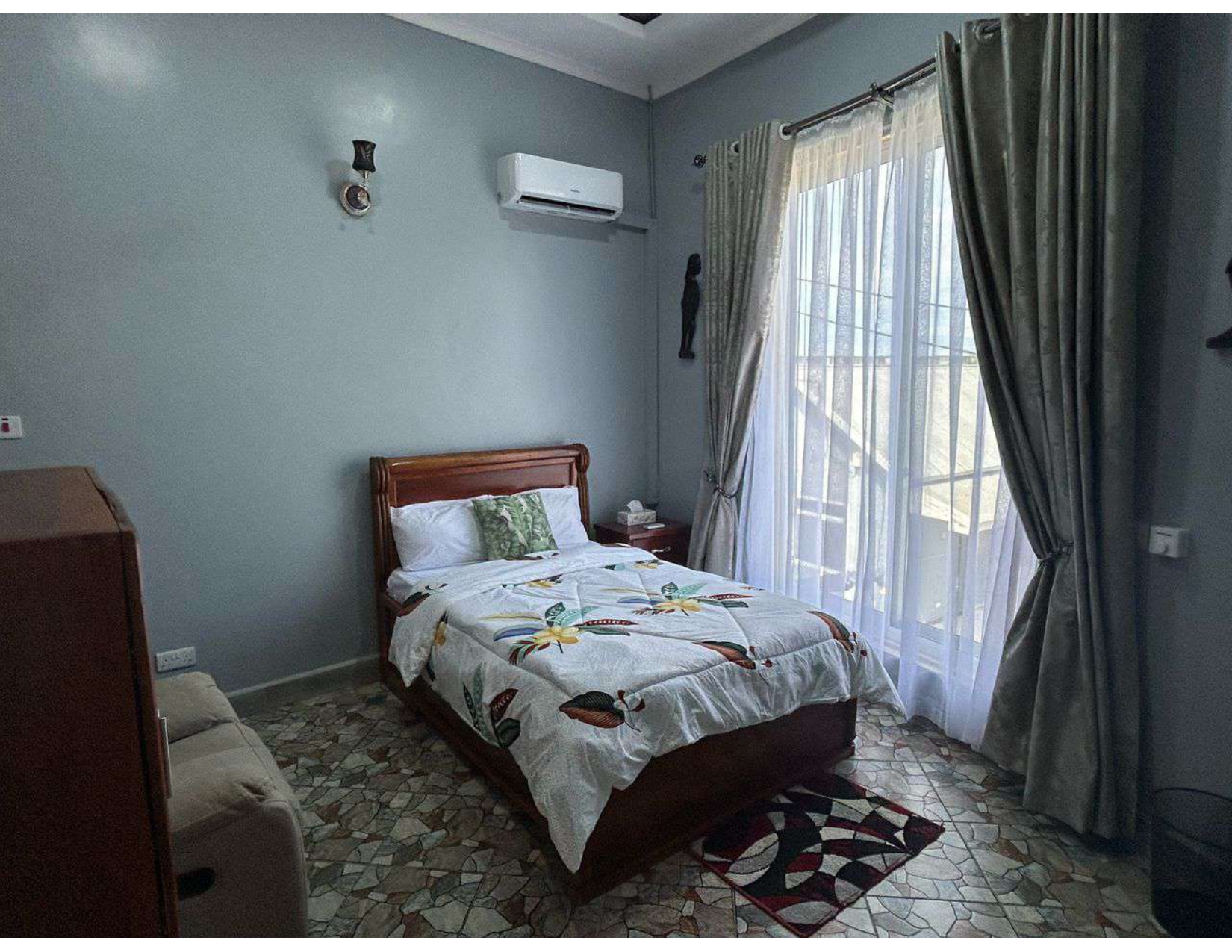 Deluxe bedroom with cozy lighting and seating area